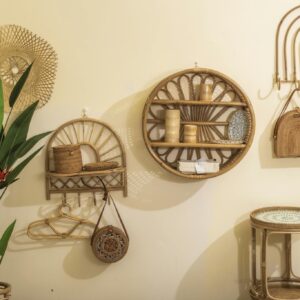 Stylish bamboo wall decor and plant in a neutral-toned living room, creating a warm atmosphere.